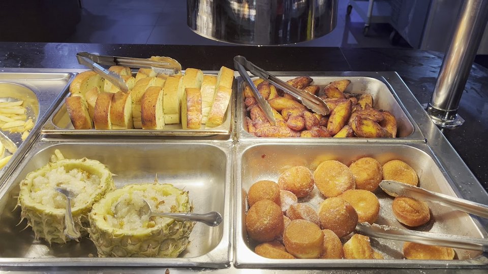 Buffet counters with sushi, seafood, and hot dishes.